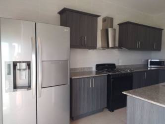 Modern kitchen with appliances and granite countertops PH Royal Palm San Carlos Beach Panama