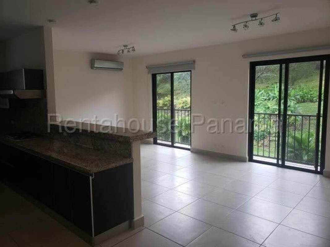 Contemporary kitchen with granite counters and dark wood cabinets Embassy Club Clayton Panama