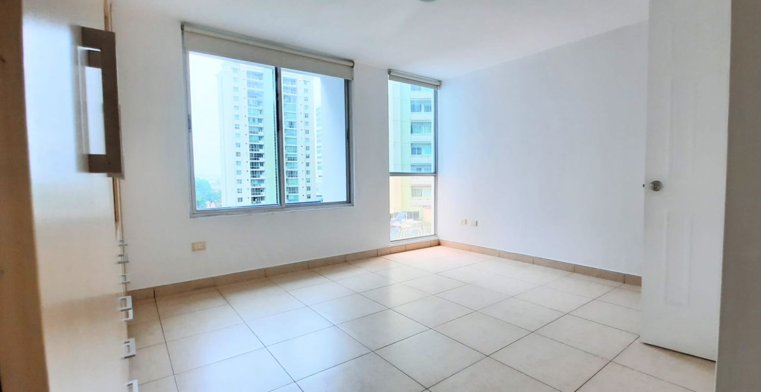 Spacious empty bedroom with large windows tile flooring and city view PH Serenade Panama
