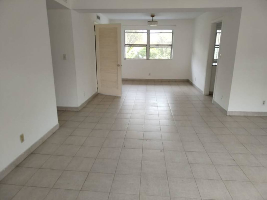 Bedroom with split AC, large window, white walls in Clayton Residences Panama City