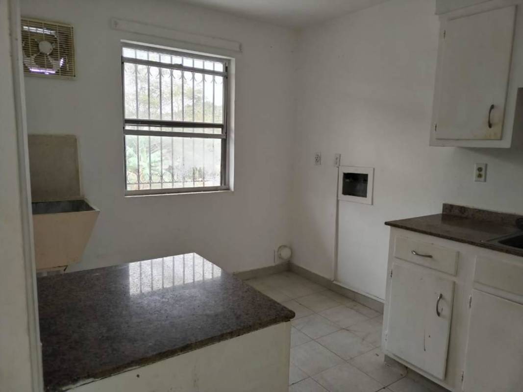 Kitchen space with granite counters and tile flooring in Clayton Residences Panama