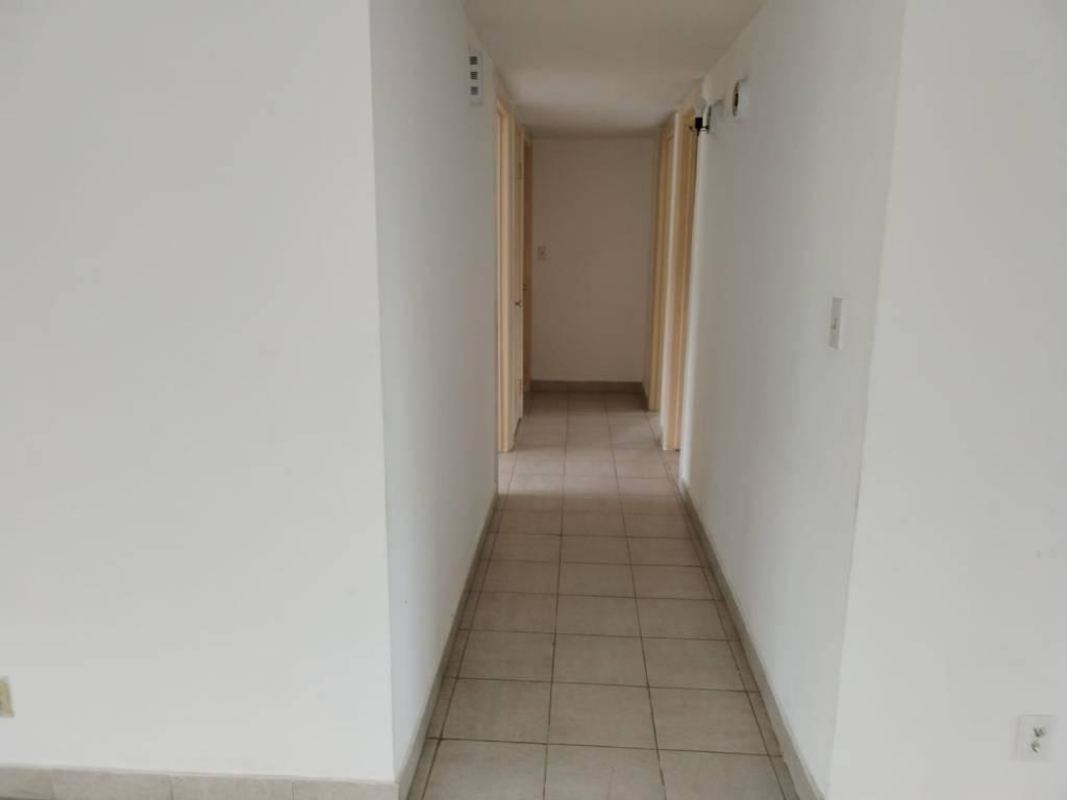 Empty interior hallway with tile flooring in Clayton apartment Panama
