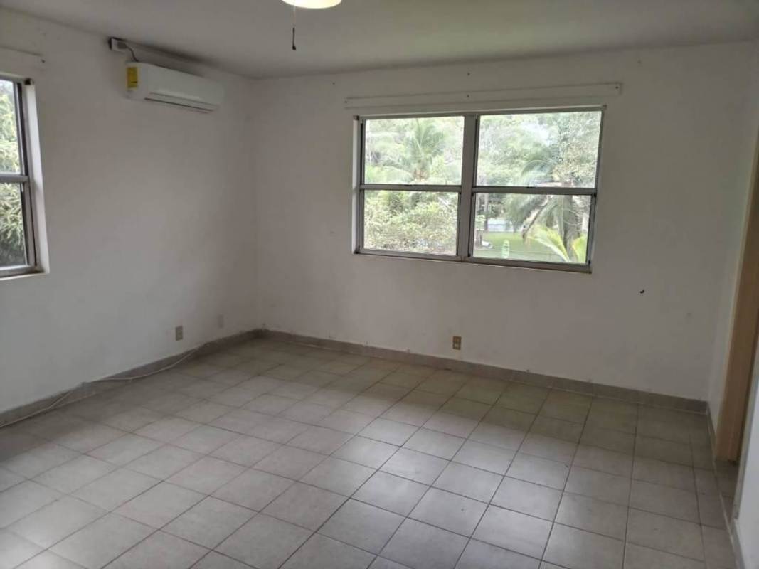 Green lawns and trees suburban housing street in Clayton Residences Panama