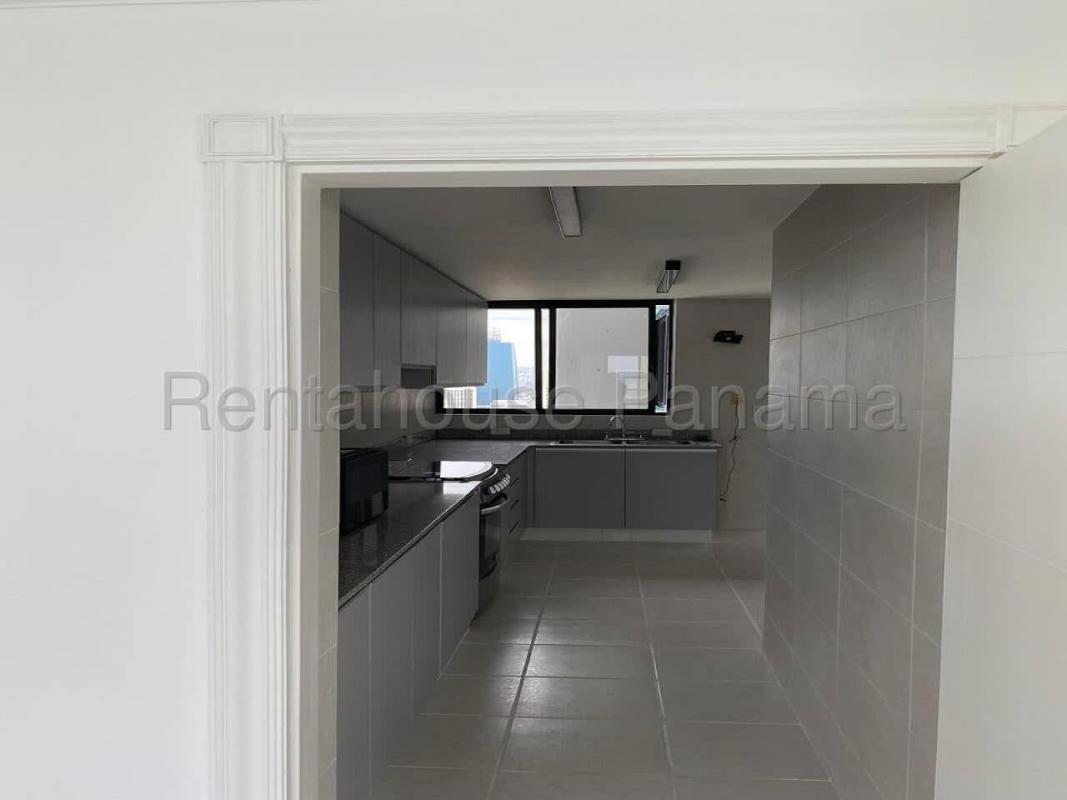 Apartment kitchen with granite counters cabinets and appliances in PH Torres del Pacífico Marbella Panama