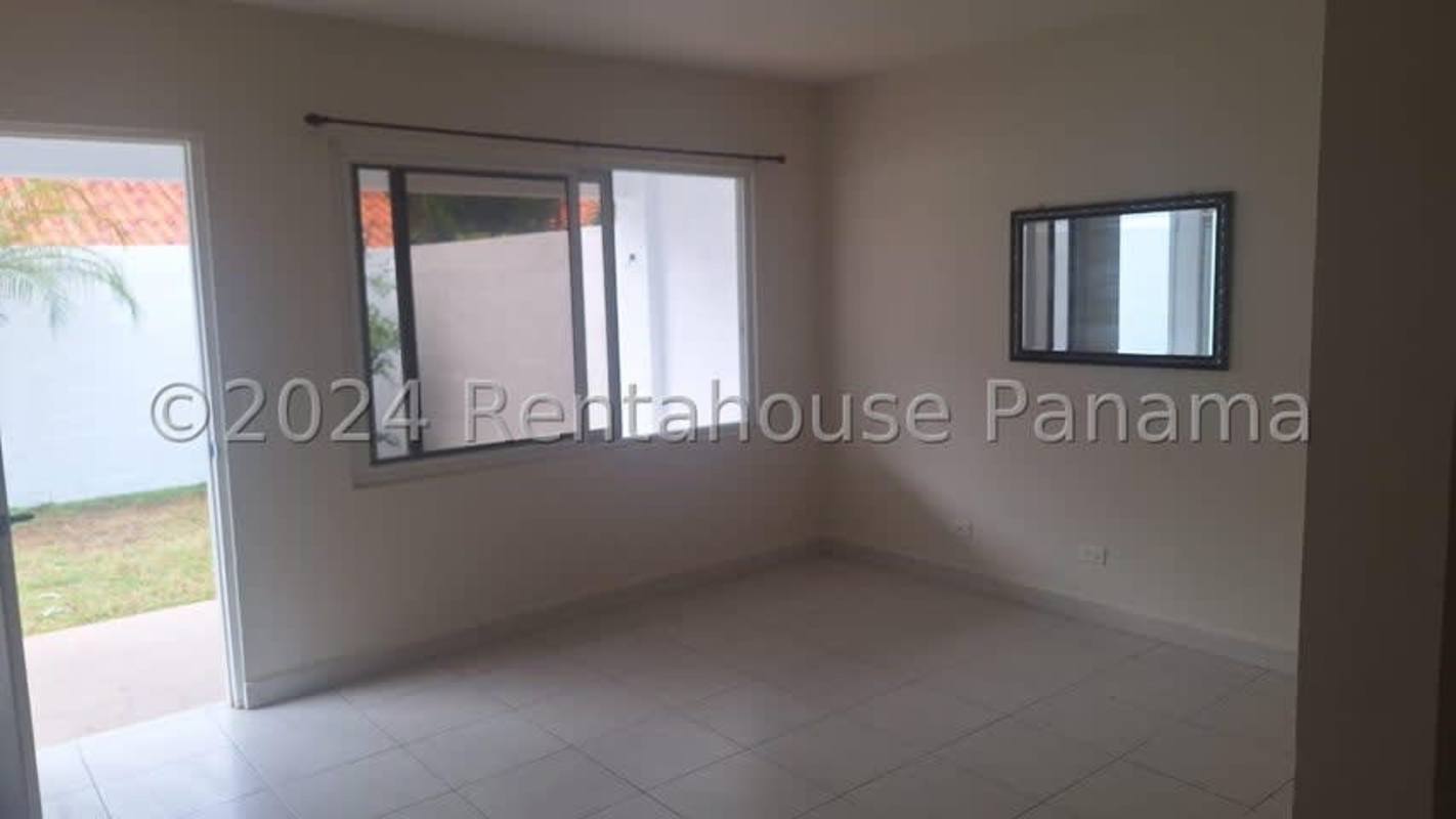 Contemporary kitchen with granite countertops, built-in appliances, breakfast bar and wood cabinets in Versalles Costa Sur Panama