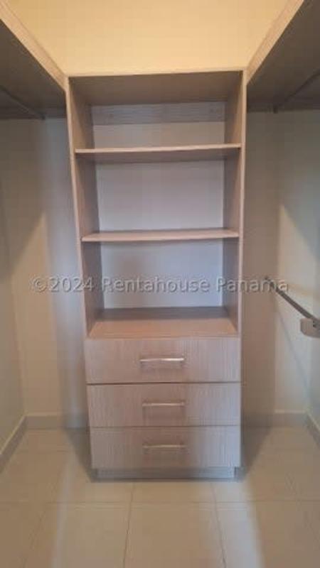 Living area with large window, neutral ceramic flooring in Versalles gated community Costa Sur Panama