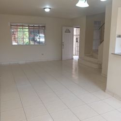 Rear fenced patio covered terrace yard duplex house Los Cortijos Arraiján Panama