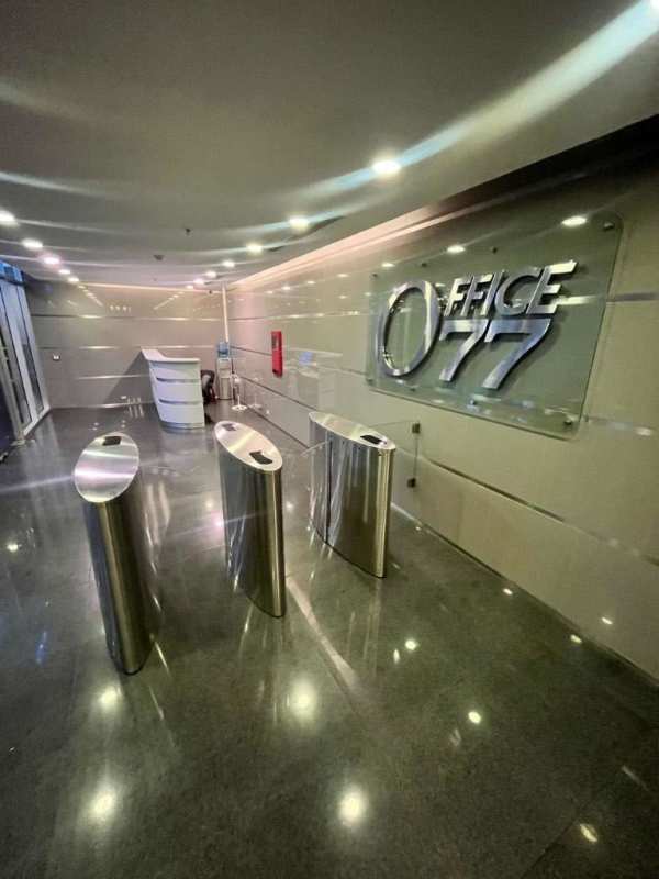 Reception area at PH Office 77 with security turnstiles and signage on Transístmica Panama City
