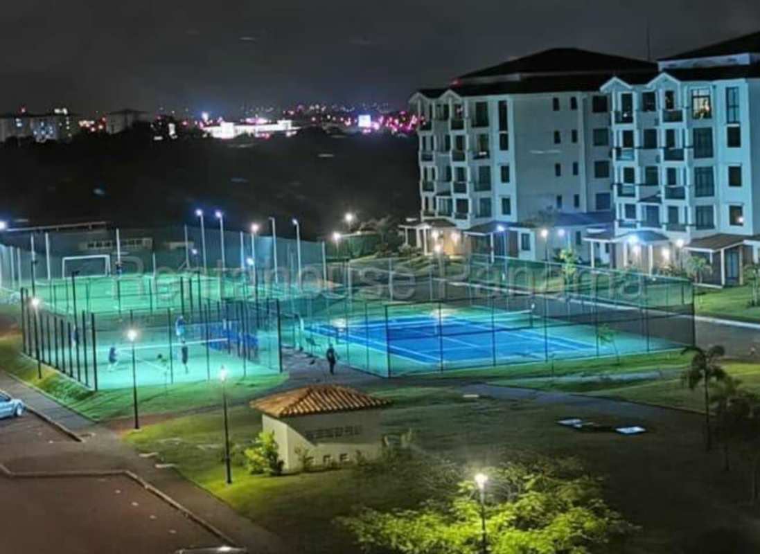 Swimming pools and playground illuminated at night in PH Costamare Costa Sur Panama