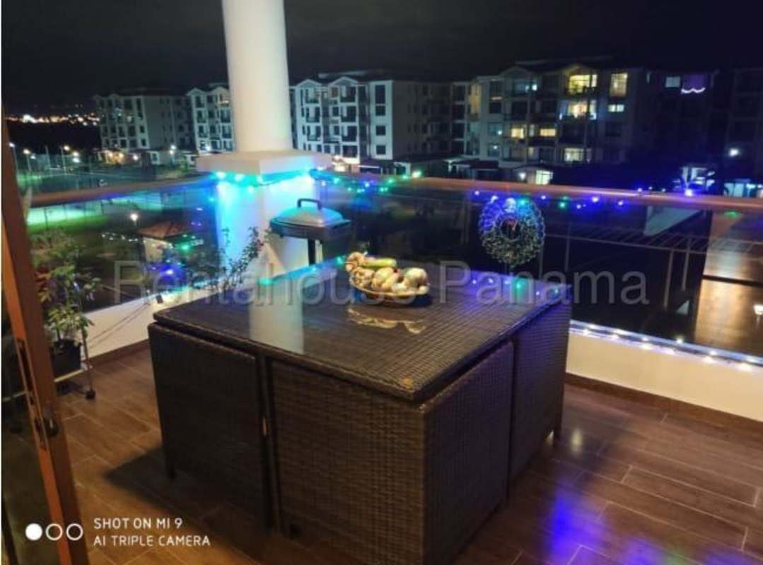 Bedroom with wardrobe, mounted TV, desk and window Costa Sur PH Costamare Panama