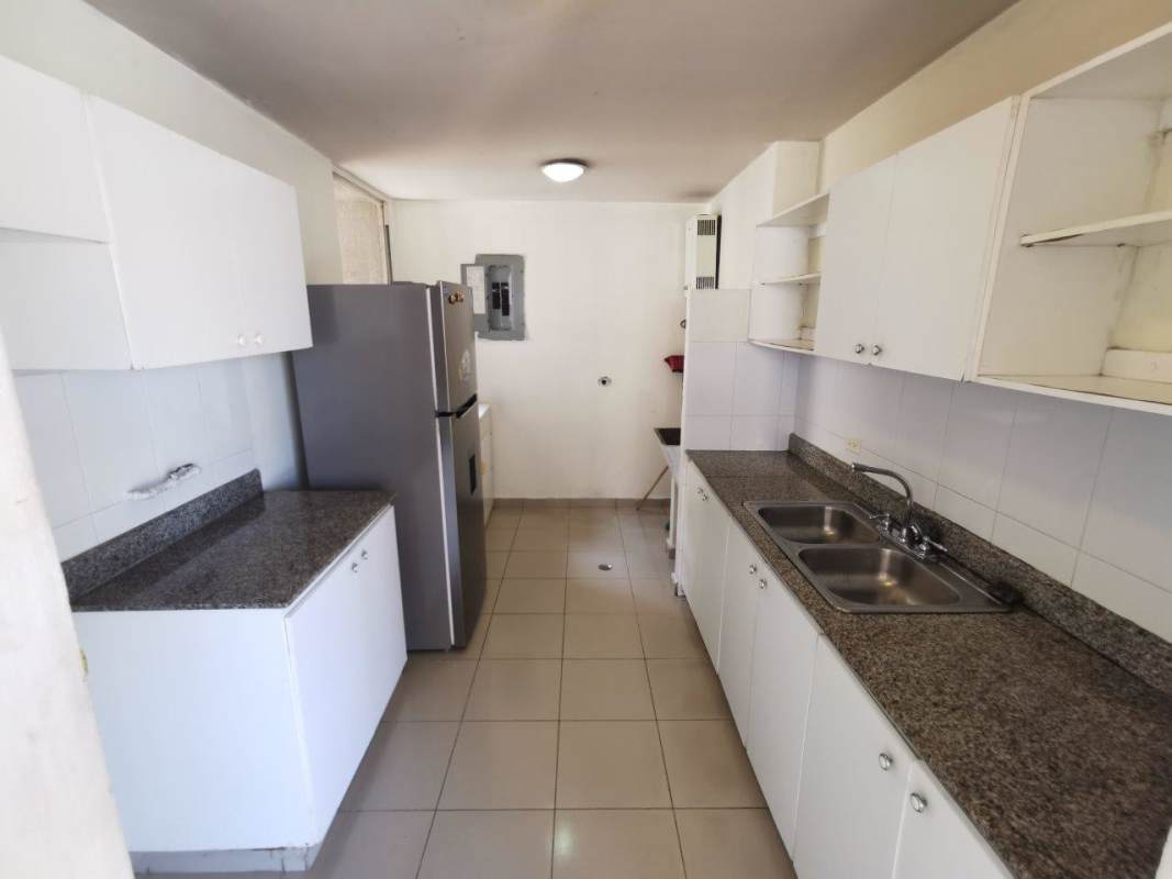 Kitchen with granite countertop and cabinetry in Mallorca Park Gardens Panama