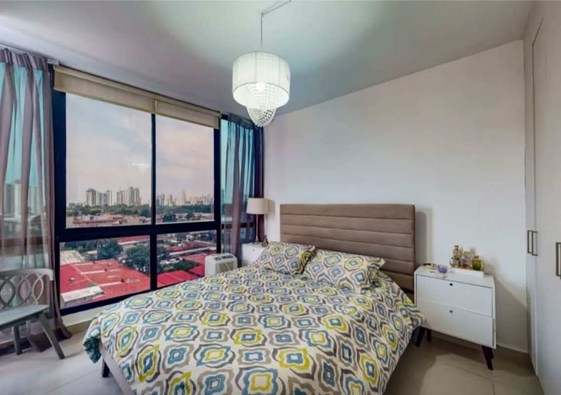Modern bedroom with floor to ceiling windows city views and built-in closet PH Canvas Tower Panama City
