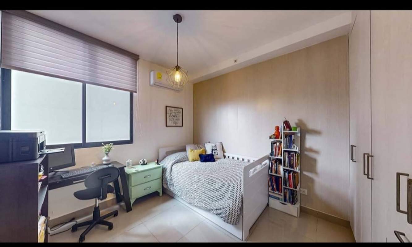 Bedroom with workspace, bed and large window at PH Canvas Tower in Parque Lefevre Panama City