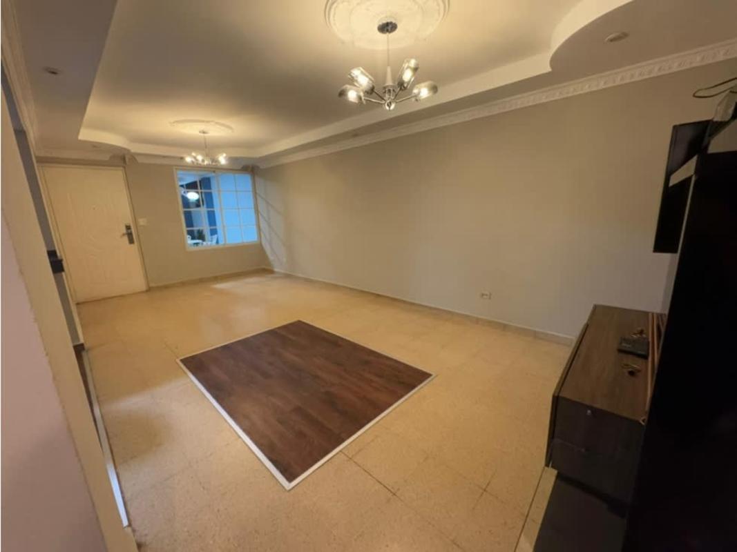 Large main living room with modern lighting and molding at Residencial Las Americas Panama