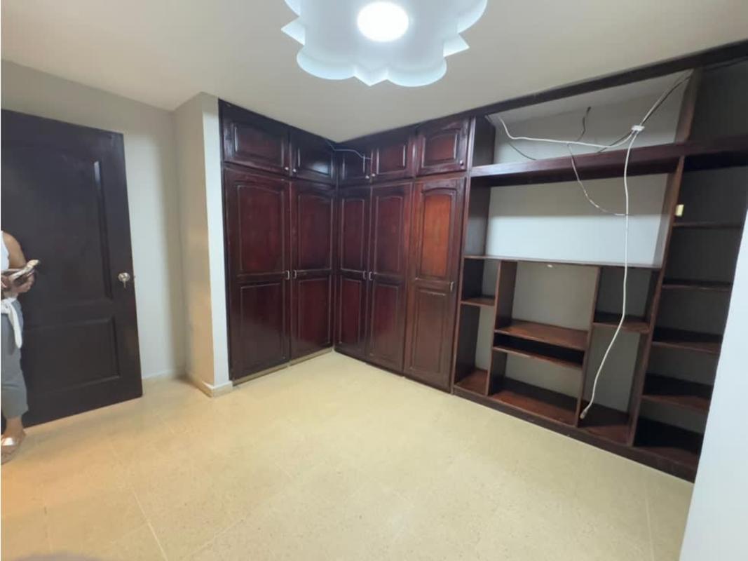 Bedroom with integrated wardrobes and tile floor at Residencial Las Americas Panama