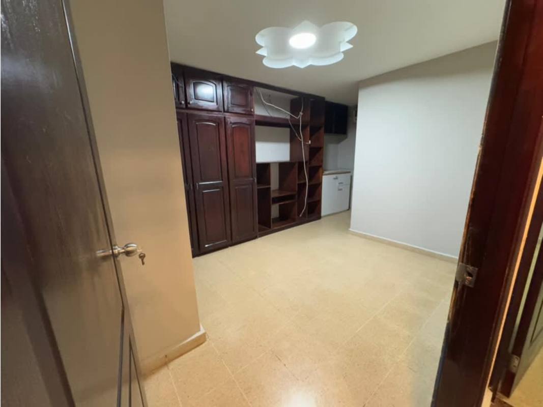 Covered patio area with garden furniture and plants in gated house Residencial Las Americas Panama