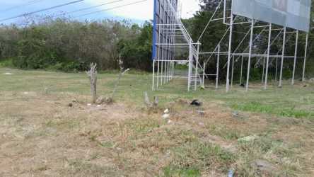 Vacant commercial roadside lot with billboard frame Nueva Gorgona Panama Oeste