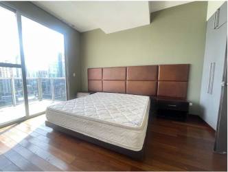 Contemporary bathroom with glass shower, modern vanity, neutral tile in Panama Pacifico apartment