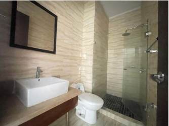 Master bedroom featuring wood floors, large window, walk-in closet PH Panama Pacifico Towers