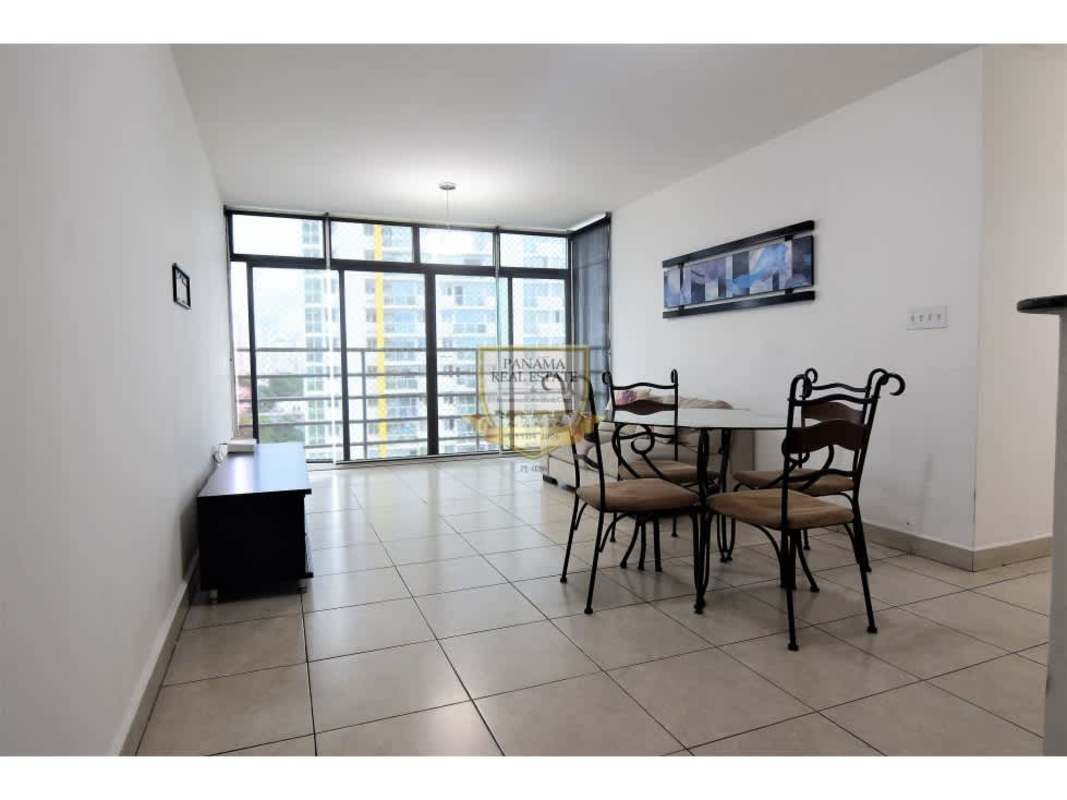 Bright furnished living-dining area with sliding balcony window in PH Los Toneles Panama City