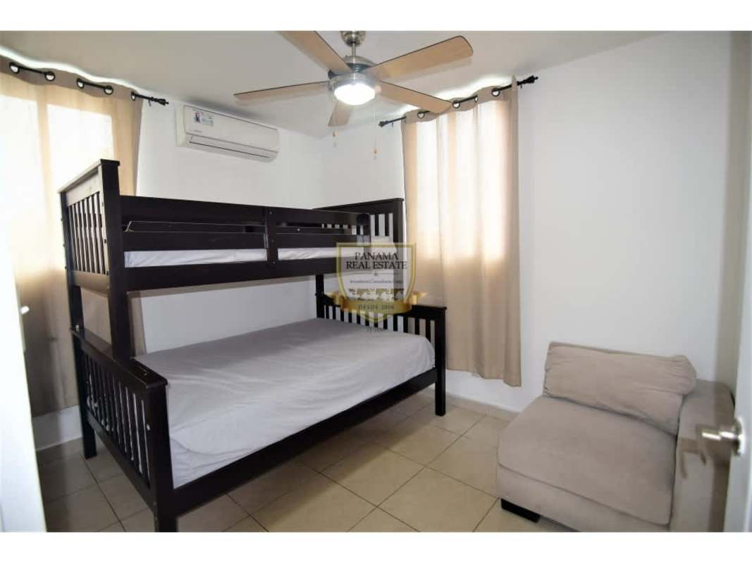Guest bedroom featuring bunk bed, ceiling fan, tile floor PH Los Toneles Panama