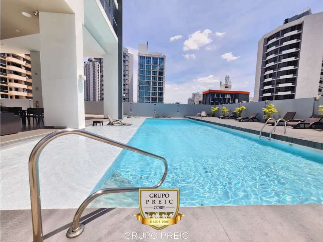 Open kitchen with granite counters and modern appliances in furnished loft PH Vitro Loft Panama City