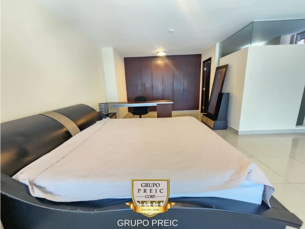 Bright modern open-plan living dining area in furnished loft rental at PH Vitro Loft El Cangrejo Panama