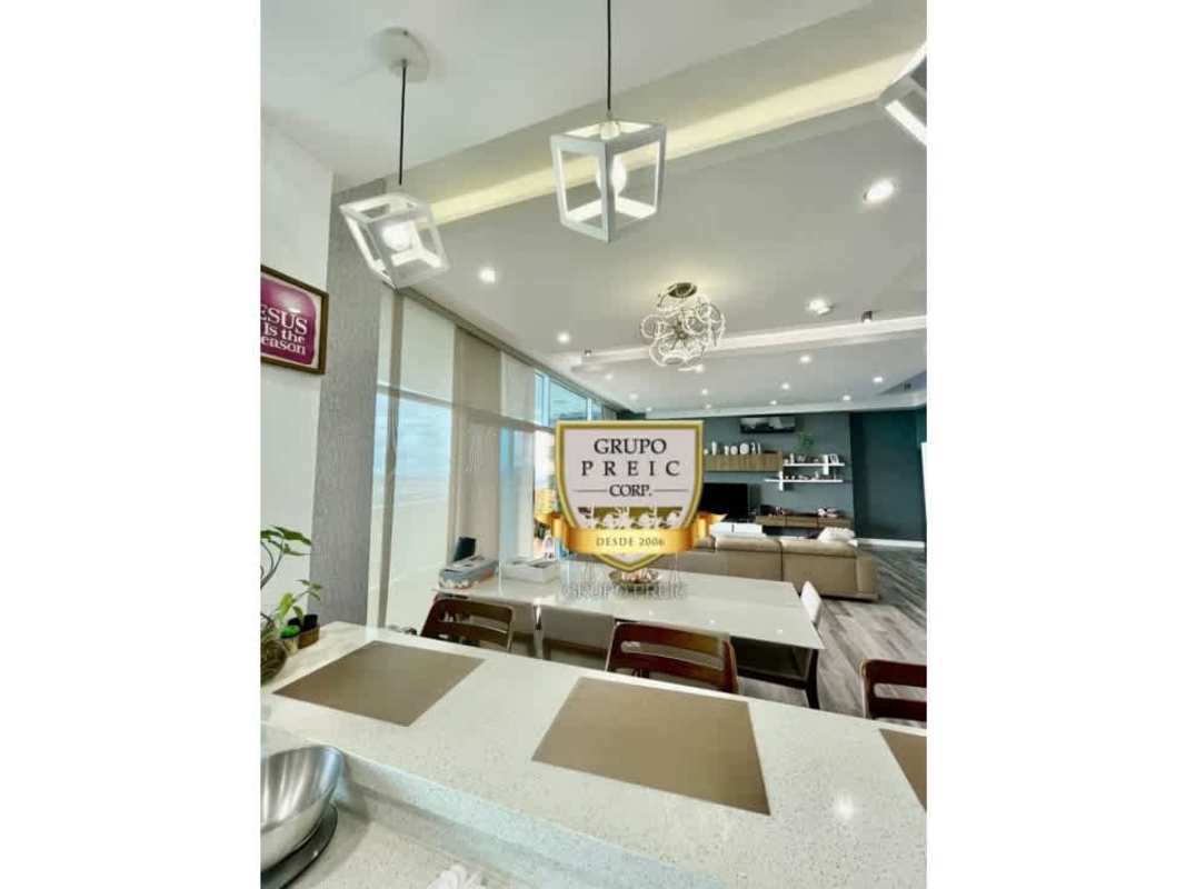 Contemporary kitchen with quartz counters, appliances and breakfast bar at PH Elite 500 Dos Mares