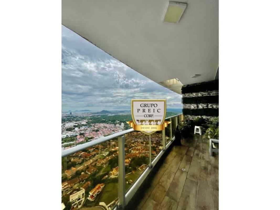 Spacious covered balcony with glass railing overlooking Panama City skyline