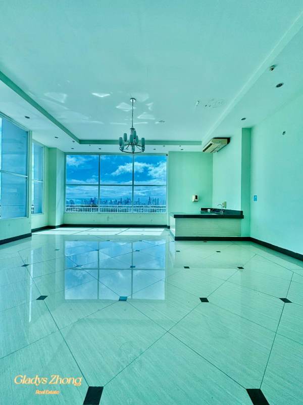 Modern lobby with large windows, seating, and skyline views at PH Lexington Tower Panama