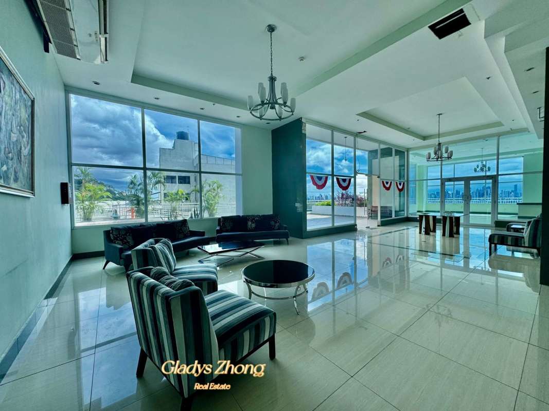 Modern lounge with large windows, panoramic views, comfortable seating in Lexington Tower Panama City