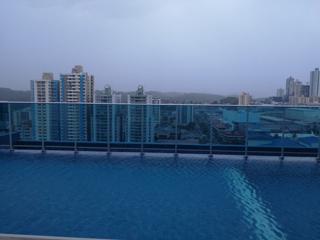 Terrace with swimming pool, playground, lounge chairs and mountain views PH Elite 500 Pacific Hills