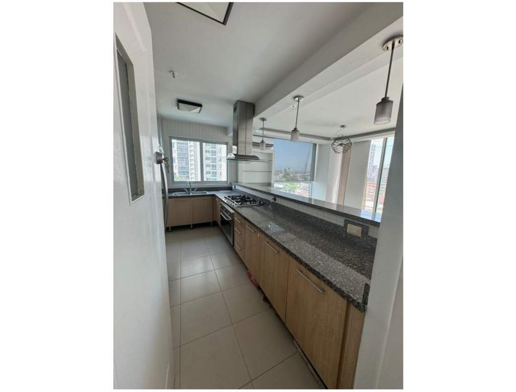 Bright bedroom with city view window, built-in closet, tile floor Tao Tower Panama