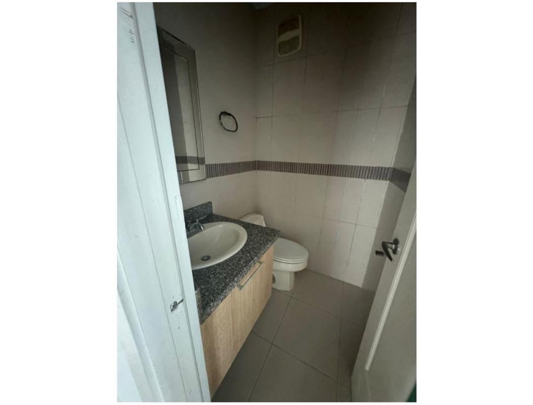 Modern open living-dining with accent wall, fan, tile flooring Tao Tower Panama