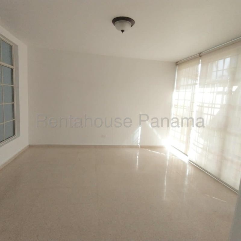 Covered terrace with tiled floor facing green garden area PH Costa Bella Costa del Este Panama