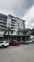 Contemporary furnished living room with large windows and balcony at PH Mosaic Panama Pacifico