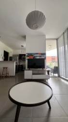 Open kitchen with island, granite counters, appliances PH Mosaic Panama Pacifico