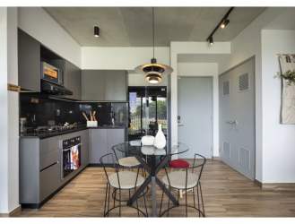 Infinity swimming pool with relaxation deck at PH Centriqo Panama Pacifico