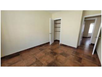 Hallway inside house featuring ceramic tiles and built-in closet in Panama Pacifico community