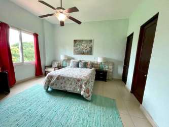 Open concept living and dining space with balcony access at Punta Barco Resort