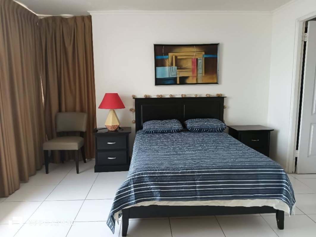 Bathroom with vessel sink granite counter glass shower PH BICSA Tower Panama