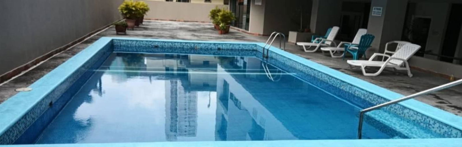 Contemporary kitchen with white cabinets countertop PH Pacific Hill Panama rental unit