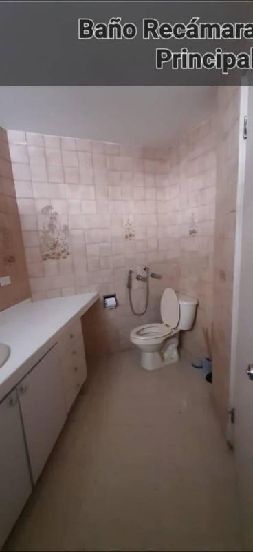 Dining room with glass table ceiling fan large windows in PH Pacific Hill Obarrio Panama