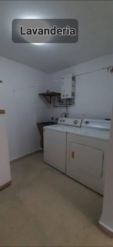 Laundry area equipped with washer dryer and water heater PH Pacific Hill Obarrio Panama