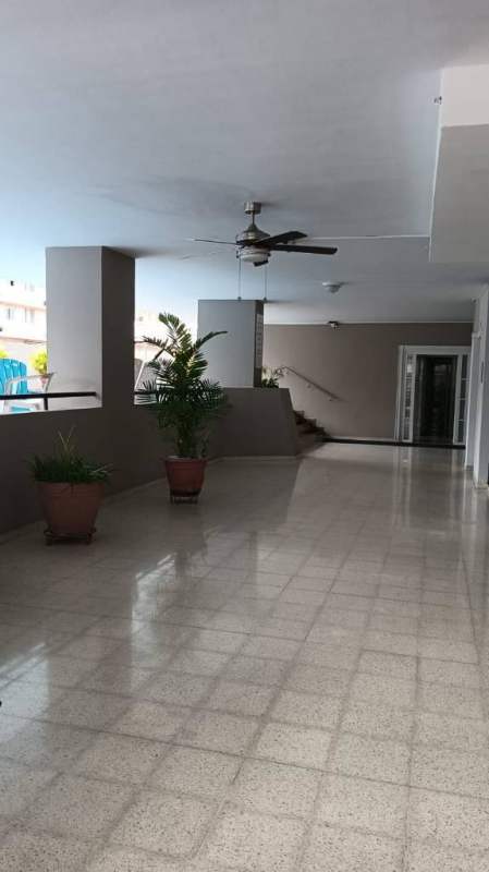 Outdoor swimming pool deck lounge chairs PH Pacific Hill Obarrio Panama apartment complex