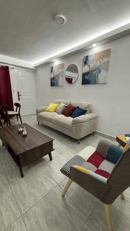 Open plan living and dining area with bright window and ceramic floors PH Villa Lua Tocumen