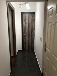 Contemporary living room with sofas, tile floor, and natural light at Las Villas de Occidente Panama