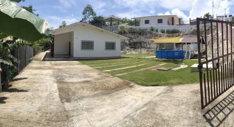 Bathroom featuring pedestal sink shower with curtain tile flooring at Las Villas de Occidente Panama