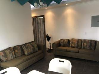 Spacious living room with sofas, large windows and TV Las Villas de Occidente El Chirú Panama