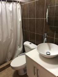 Contemporary kitchen with cabinetry gas cooktop and window at Las Villas de Occidente El Chirú Panama